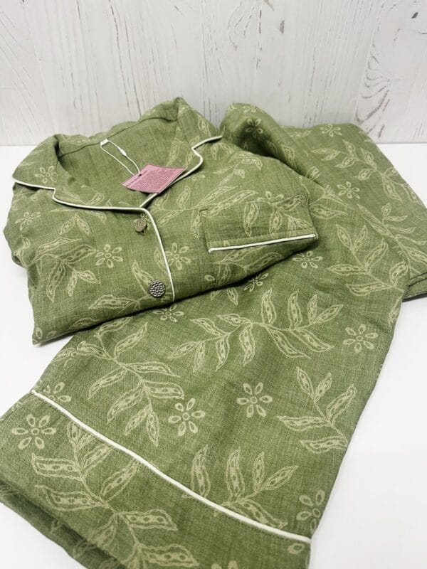 Sage green printed Turkish linen blend pajama set folded on a white surface